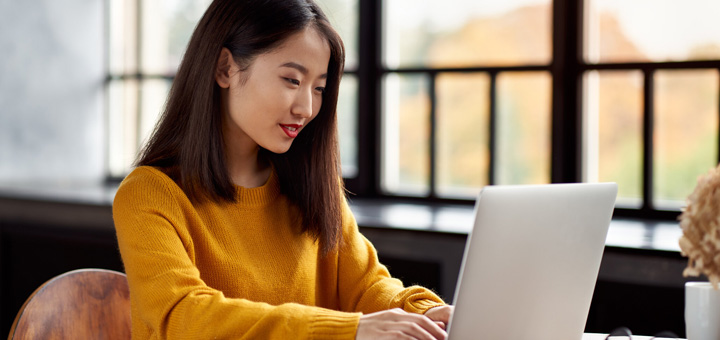 woman typing laptop